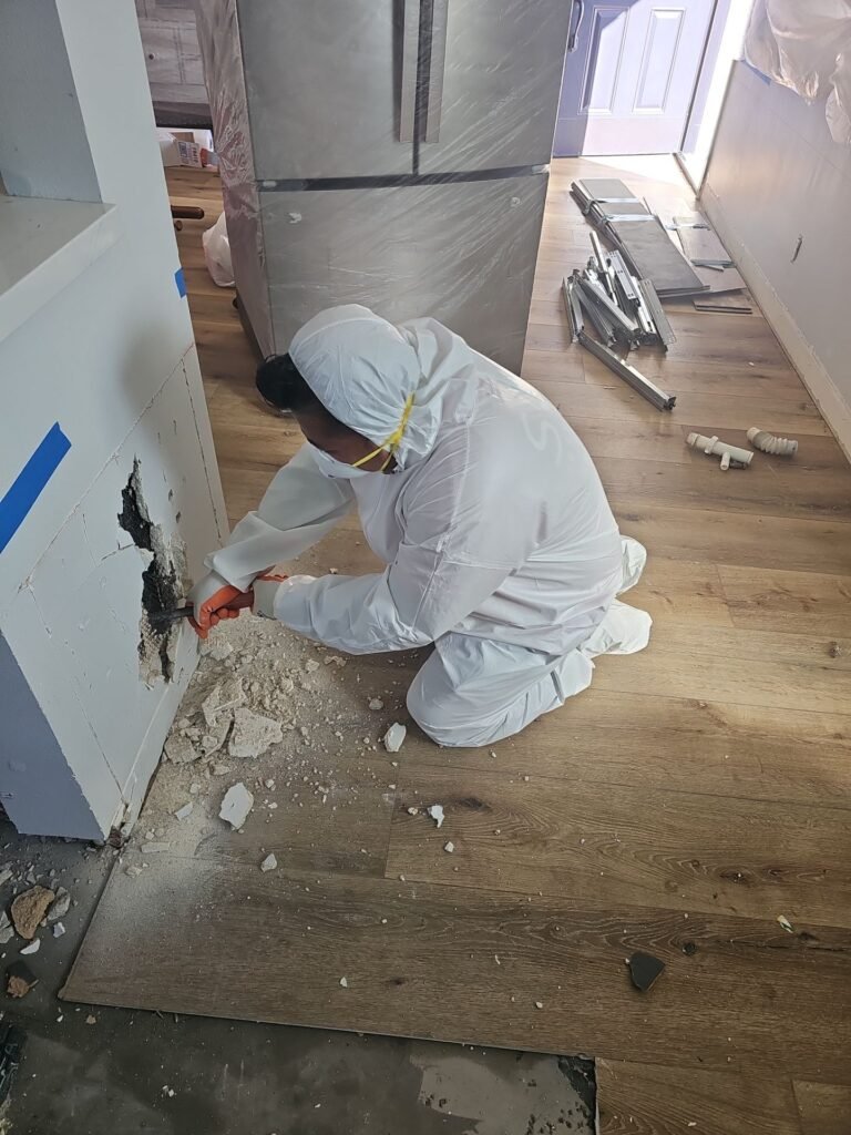 Drywall cut back to sound material during a mold removal