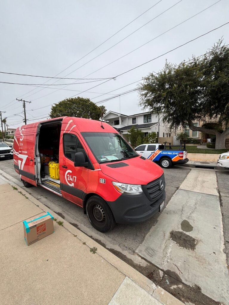 The SOS van open at the curb of a residential street